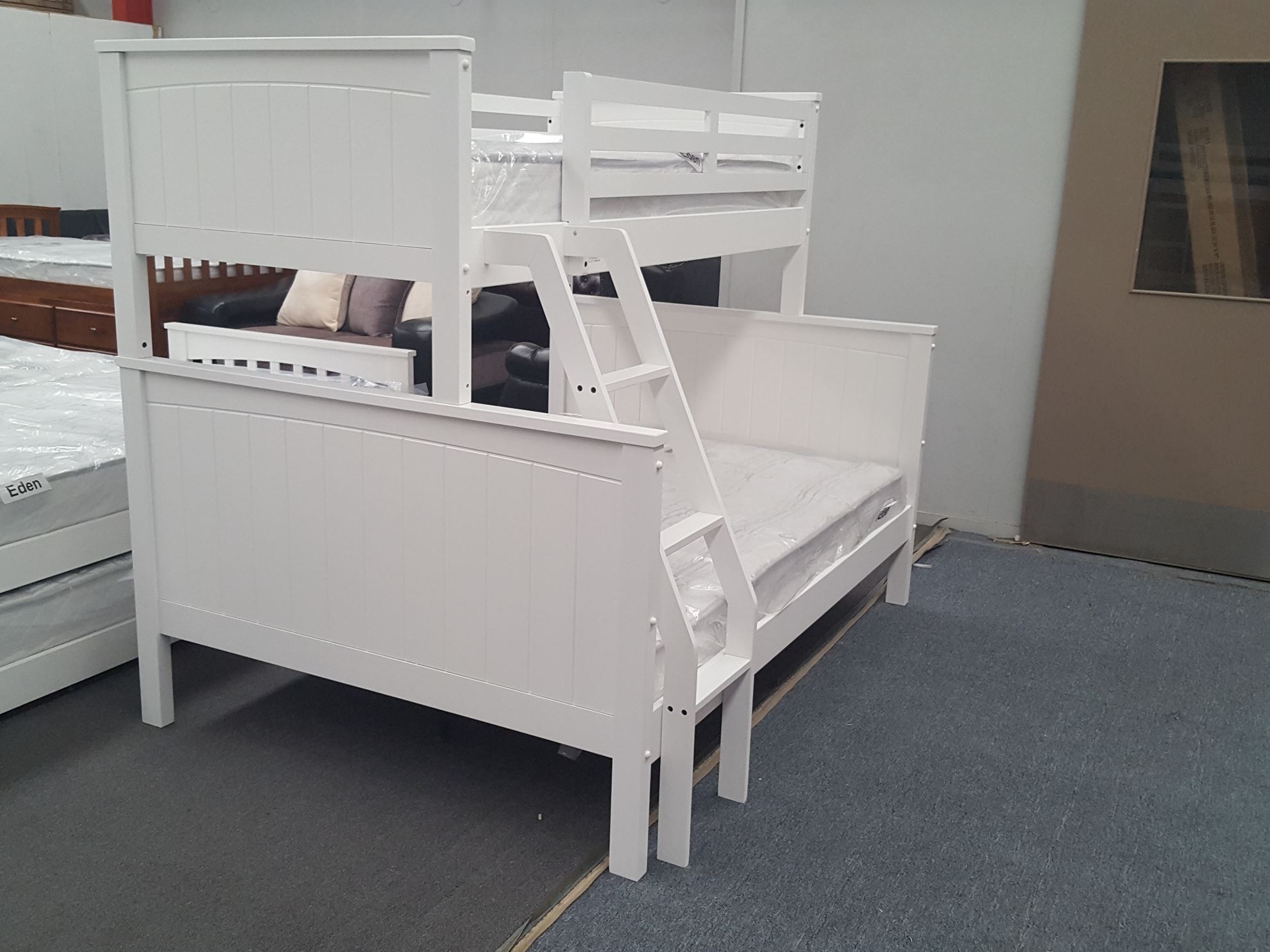 white wooden bunk beds with mattresses