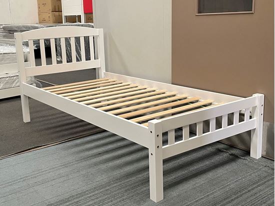 White single bed with wooden frame