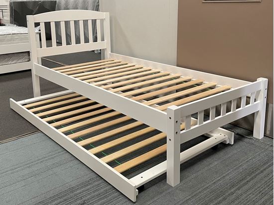 White single bed with wooden frame trundle