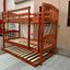Miki Solid Hardwood Bunk Bed with Trundle in Antique Oak finish, featuring premium craftsmanship and space-saving design